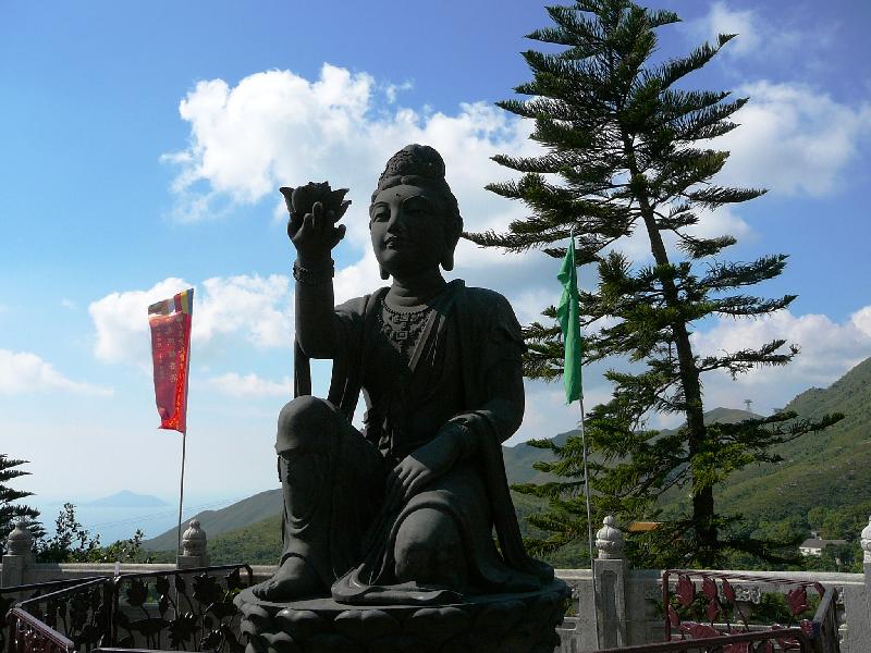 statue offering a flower