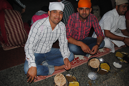 The simple food is vagatarian and consists of flatbread, lentil sauce and vegetable sauce