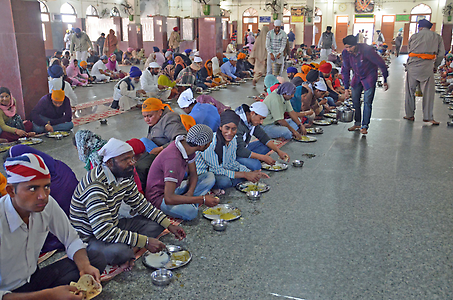 After having sit down in long rows, you eat togeher with others