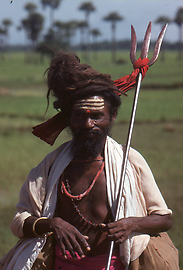 On pilgrimage in southern India. As an attribute he carries the trident of Shiva