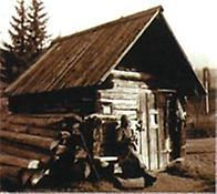 Die Büchsenmacher-Rosl vor ihrer Köhlerhütte in Jauring