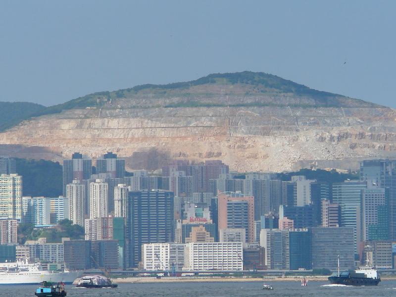 modern buildings on waterfront and building lot behind them