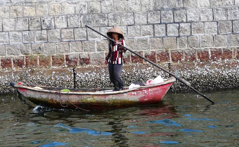 fisherman standing on a boat