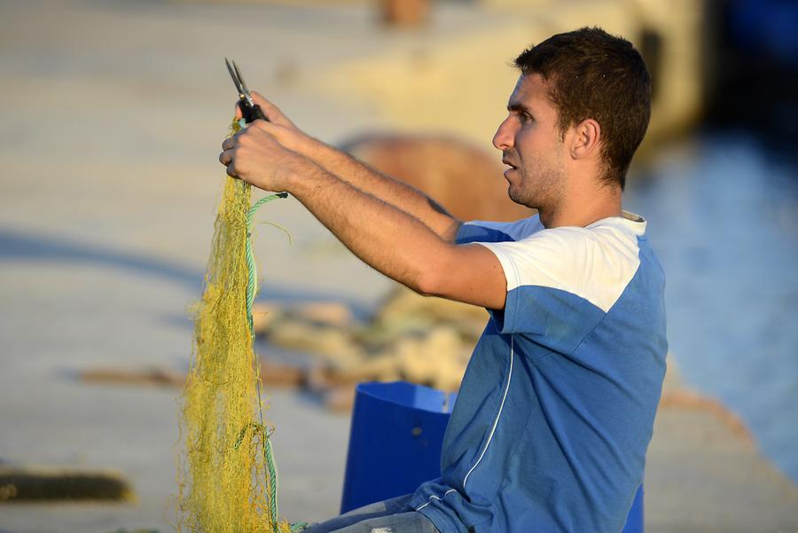 Sitia - Harbour; Fisherman