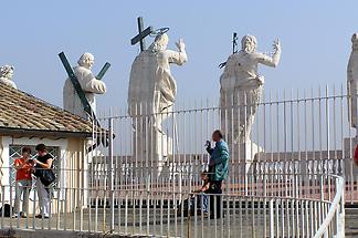 Behind the statues