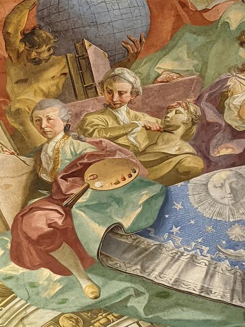 Mögliches Selbstporträt Johann Wenzel Bergl als Maler mit Farbenpalette, links. Detail aus Deckenfresko im Augustiner-Lesesaal der ÖNB, 1773-75
