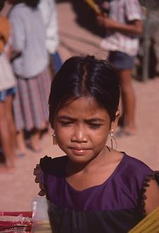 Incense sticks selling young girls in the ruins of Ta Keo.