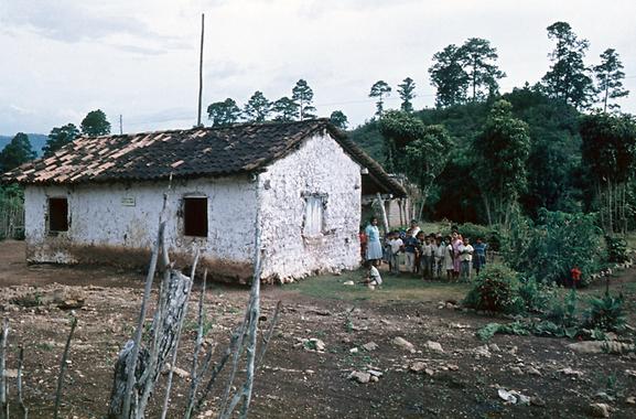 The small one room school of El Florido with the two teachers and the school children