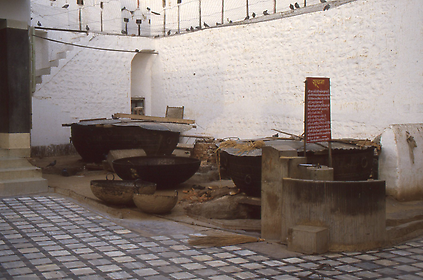 Food is prepared for the rats from donations of the pilgrims