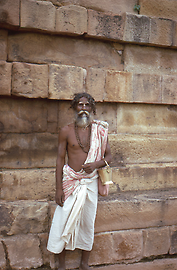 Sadhu with begging bowl in Sarnath near Varanasi / Benares, a prominent Buddhist pilgrimage site