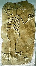 Steinplatte mit Helios-Skelett an der Pfarrkirchen-Südwand