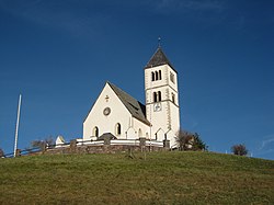 Pfarrkirche St. Wolfgang mit Friedhofskapelle und Friedhof in Radein