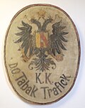 Tabakmuseum in Frastanz, Rathaus – Wandschild: "k. k. Tabak-Trafick" mit Doppeladler.