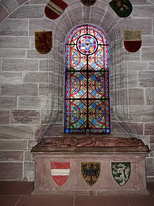 Sarkophag im Basler Münster. Inschrift: Gertrud Anna Gemahlin Rudolfs von Habsburg. Geborene Gräfin von Hohenberg † 1281. Graf Karl von Habsburg, deren Söhnlein † 1276 Tumba Gertruds von Hohenberg und ihres Sohns Karl von Habsburg im Basler Münster, sie zeigt neben dem österreichischen Bindenschild den römisch-deutschen Königsadler und den steirischen Panther